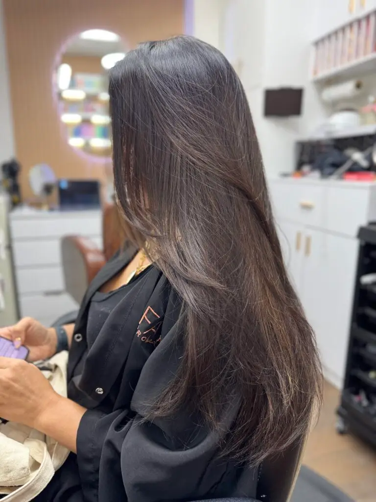 Brunnete balayage in rich chocolate tones. Subtle highlights and melted color for a natural, radiant glow. Client also has sew-in hair extensions, for fulness and glamorous look.