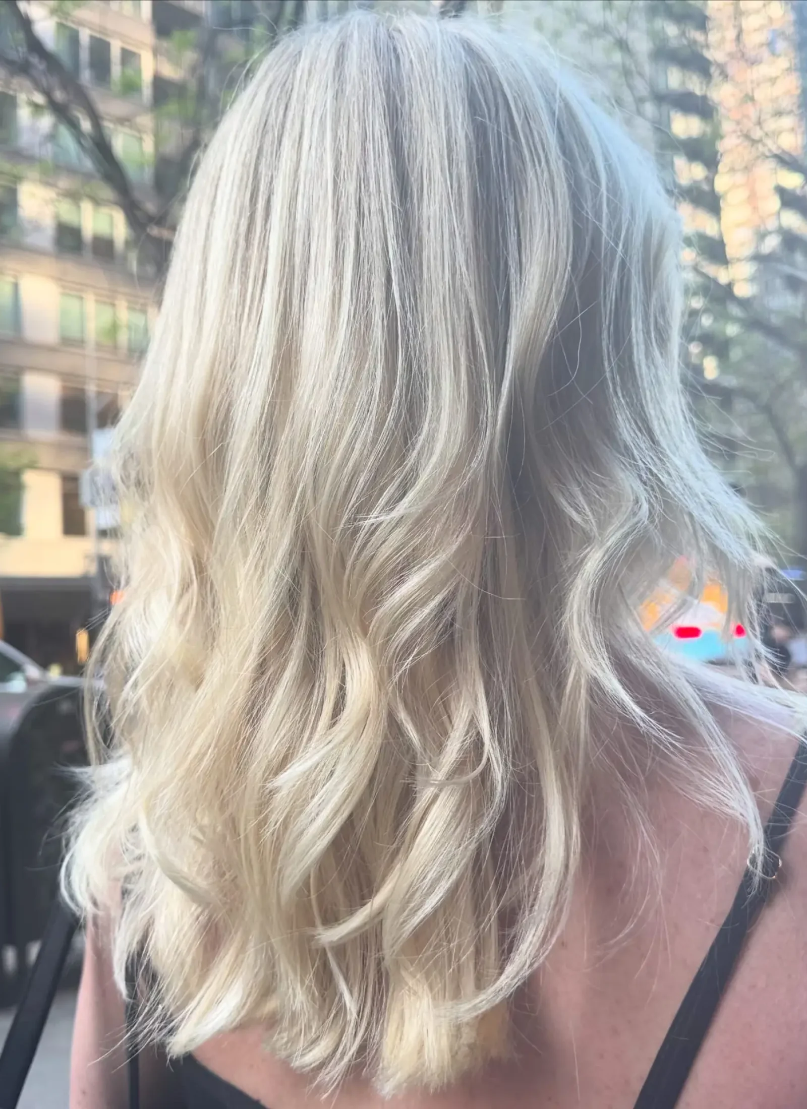 8CF3B18D-F8C8-4AF9-81EE-2BAE4D37F103 Bright blonde balayage at Fabi Pro Beauty, Midtown East Manhattan - luminous tone, soft waves and radiant shine on layered cut