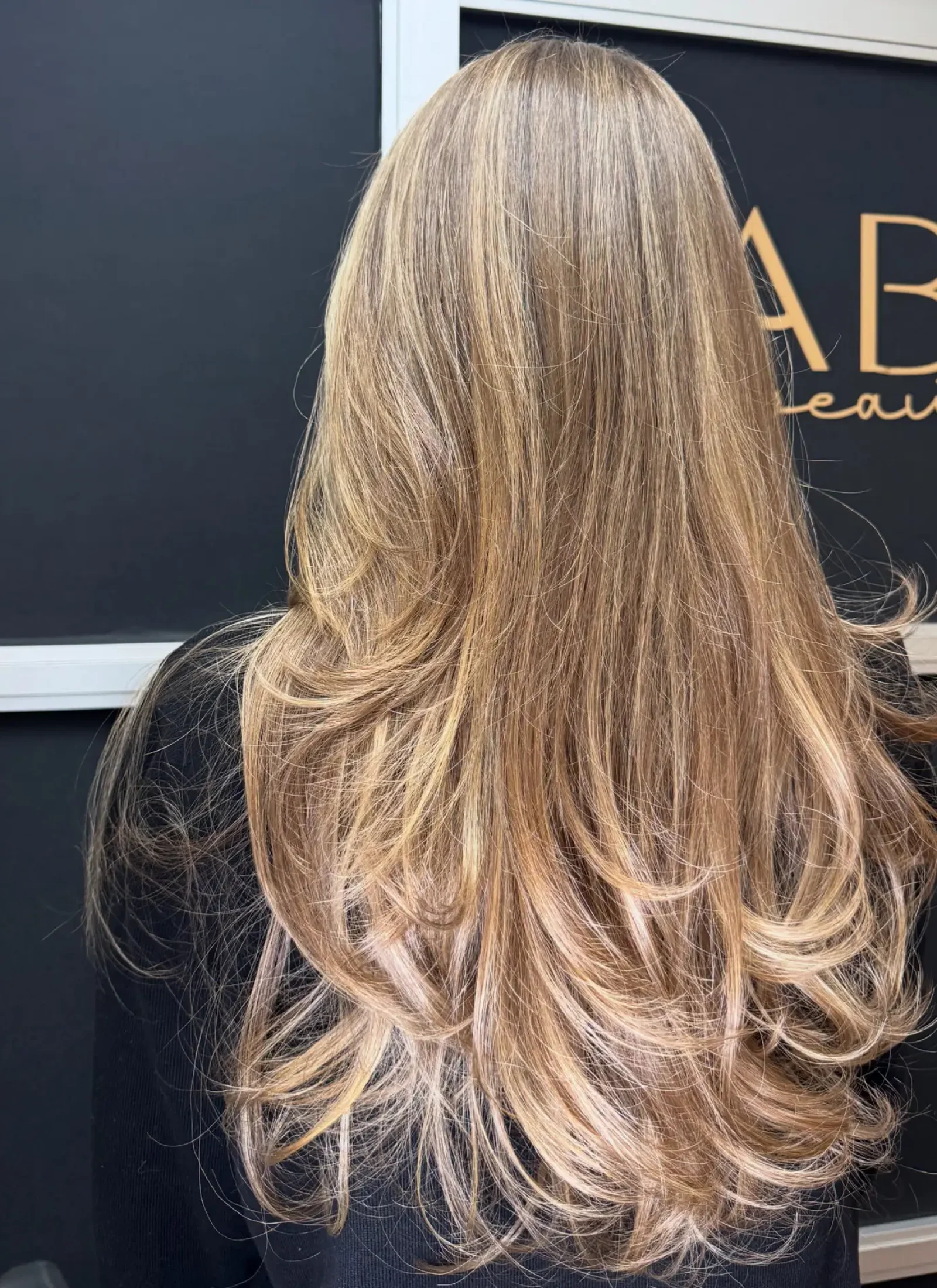 986473C8-4DED-4345-8220-16F452CF9B76 Bronde milk balayage by Fabiana Cohen at Fabi Pro Beauty, Midtown East Manhattan - soft brunette and blonde blend with creamy dimension and glossy finish.