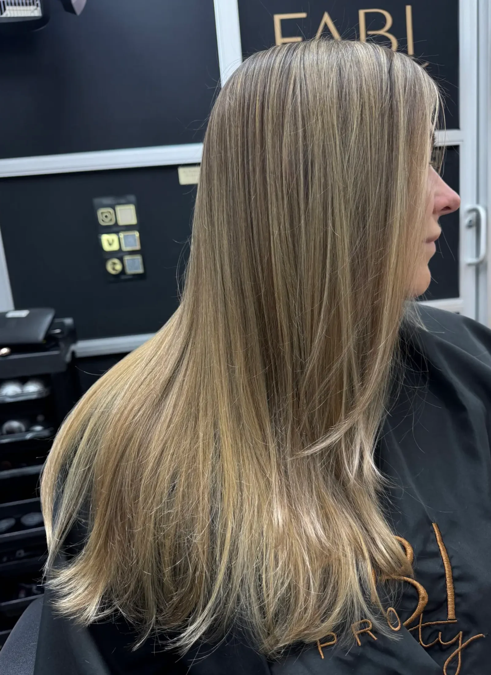 Beige bronde tone with a smooth, silky finish – effortless shine and movement by Fabi Pro Beauty Smooth beige bronde balayage, by Fabiana Cohen at Fabi Pro Beauty, Midtown East Manhattan NYC - soft shine, natural dimension and healthy finish